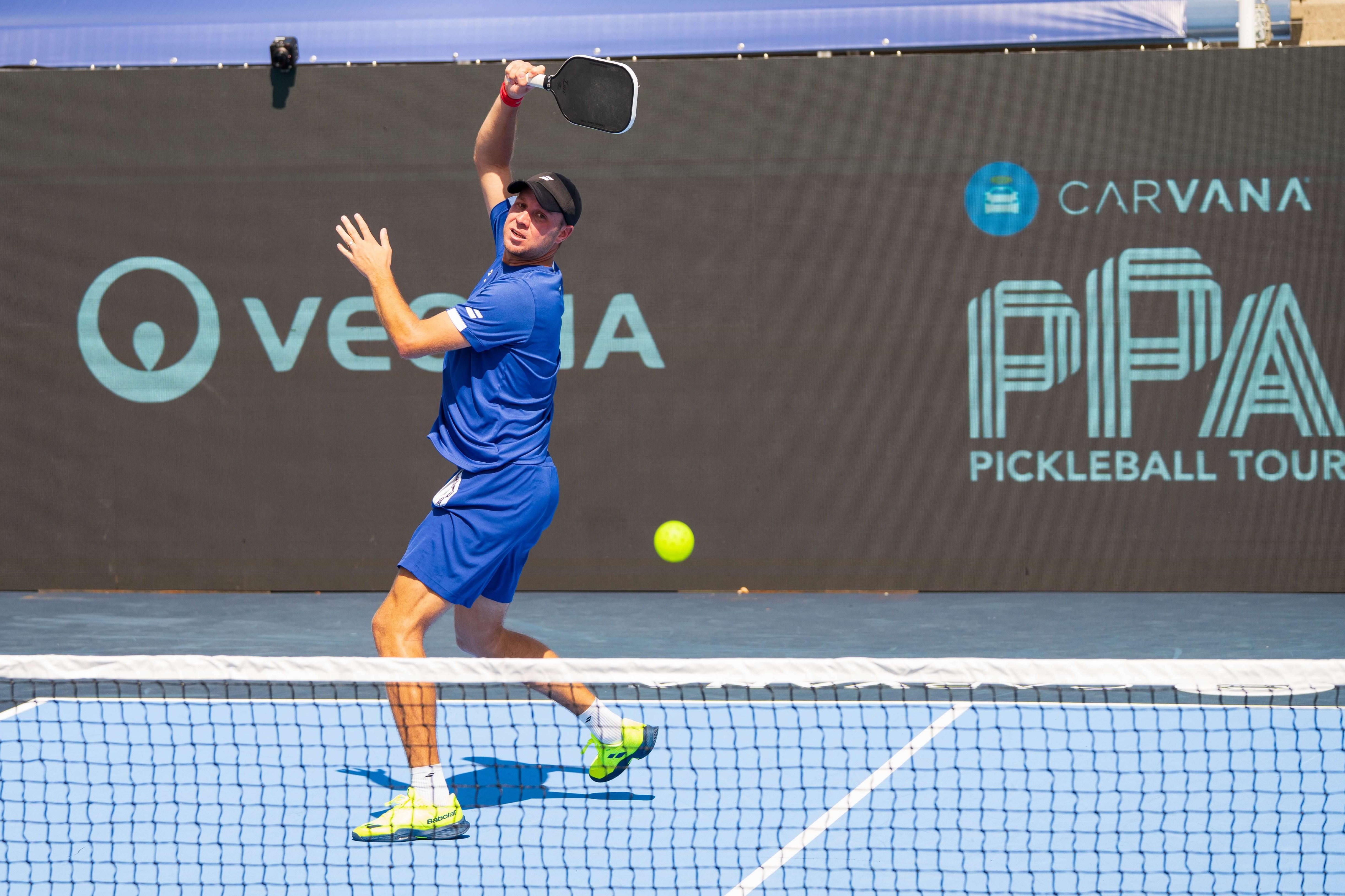 Haworth in electric blue outfit and neon yellow shoes